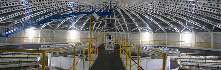 Accelerator. Shot from the inside. Metal top and construction. In the center there is a platform.